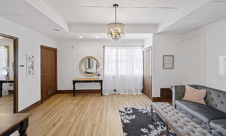 Bridal room details — shoes, jewelry, and the wedding gown by the window